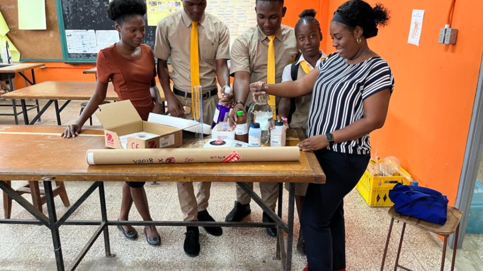 Garvey Maceo High School students use the supplies received